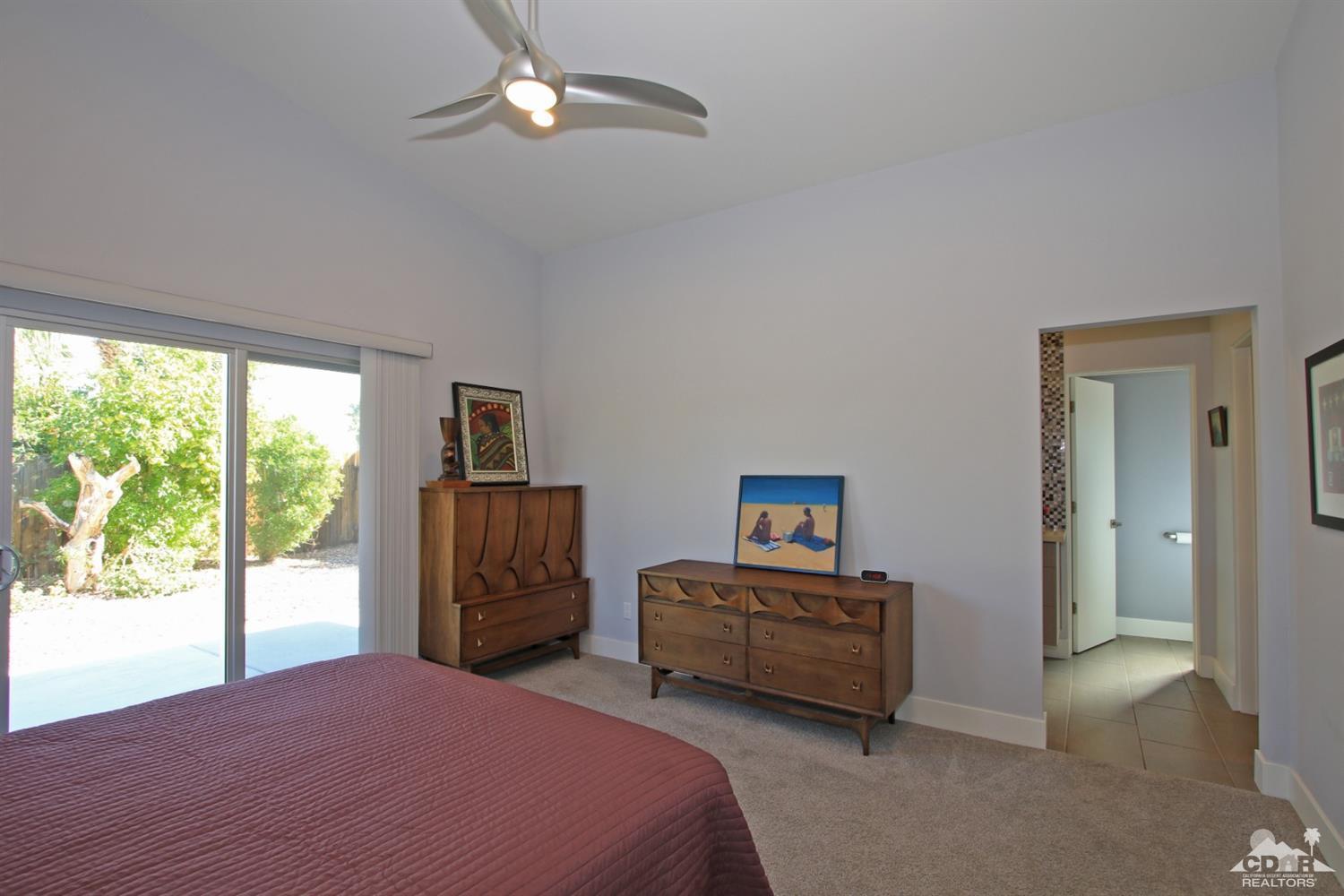 71728 Tunis Road Rancho Mirage, CA 92270 - Photo 17 of 44 a bed room with a bed and a window