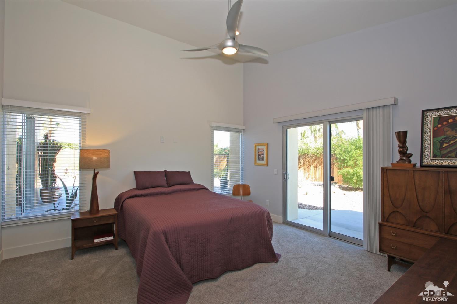 71728 Tunis Road Rancho Mirage, CA 92270 - Photo 18 of 44 a bedroom with a bed and a window