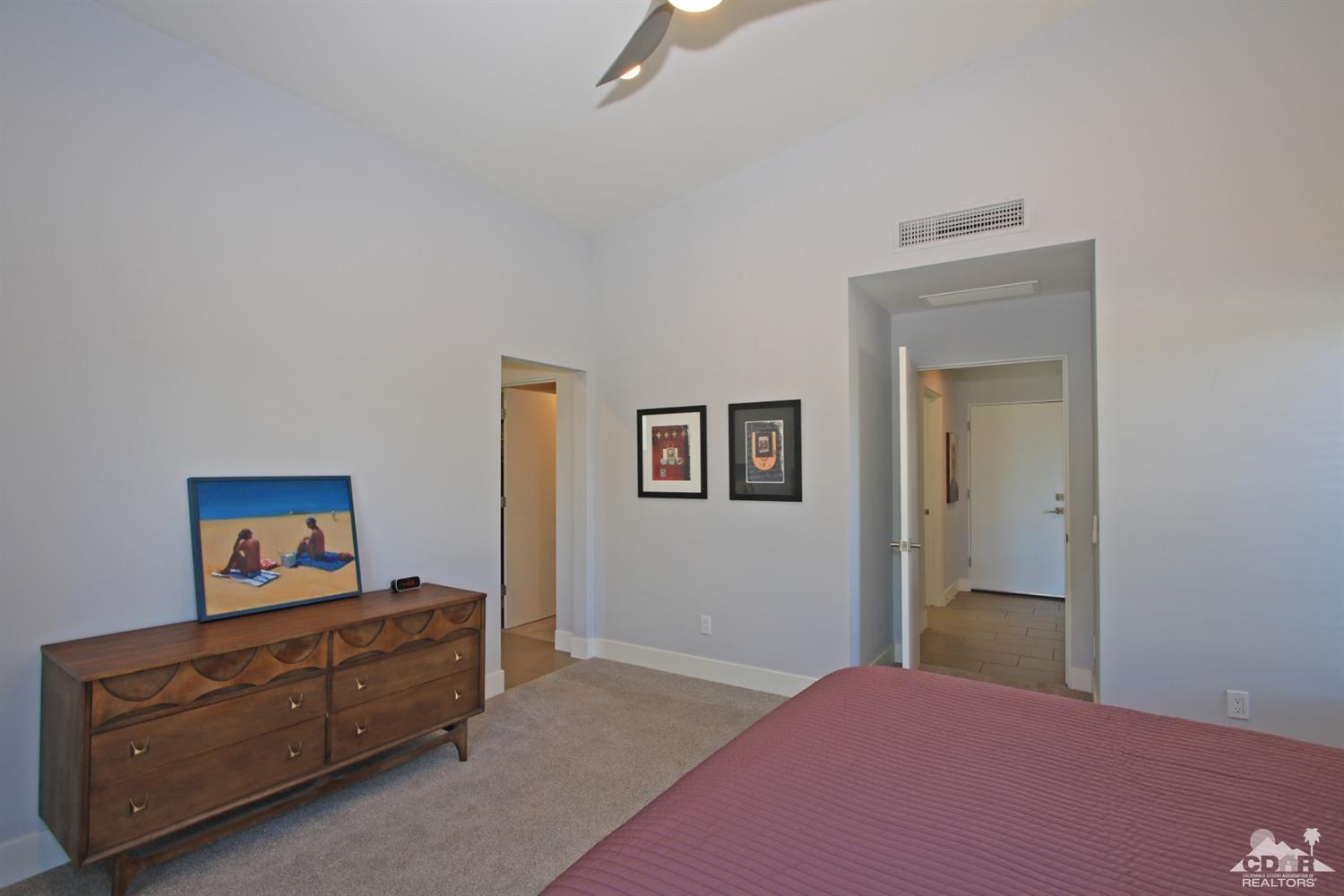 71728 Tunis Road Rancho Mirage, CA 92270 - Photo 20 of 44 a bedroom with furniture and a bed