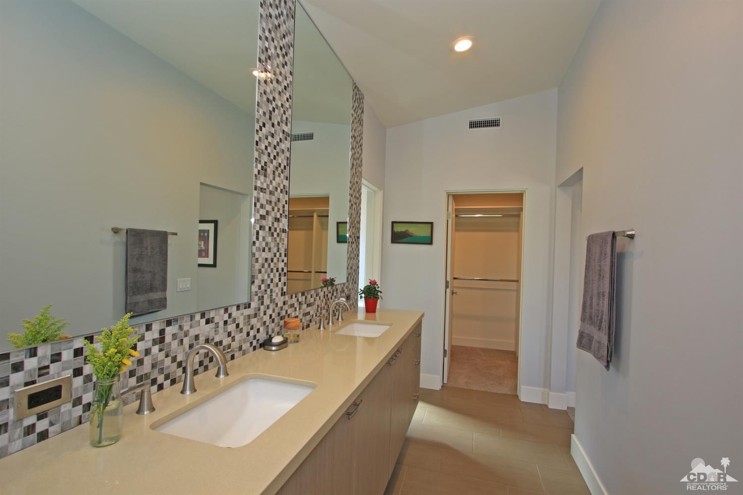 71728 Tunis Road Rancho Mirage, CA 92270 - Photo 23 of 44 a bathroom with a tub sink and mirror