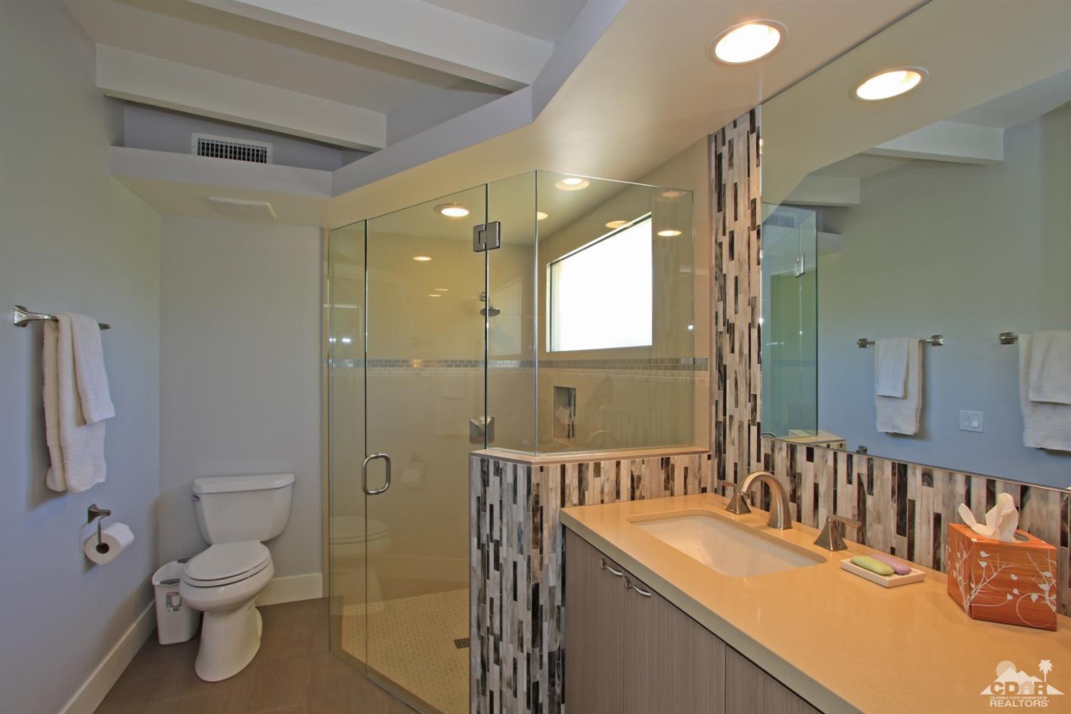 71728 Tunis Road Rancho Mirage, CA 92270 - Photo 27 of 44 a bathroom with a sink toilet vanity and shower