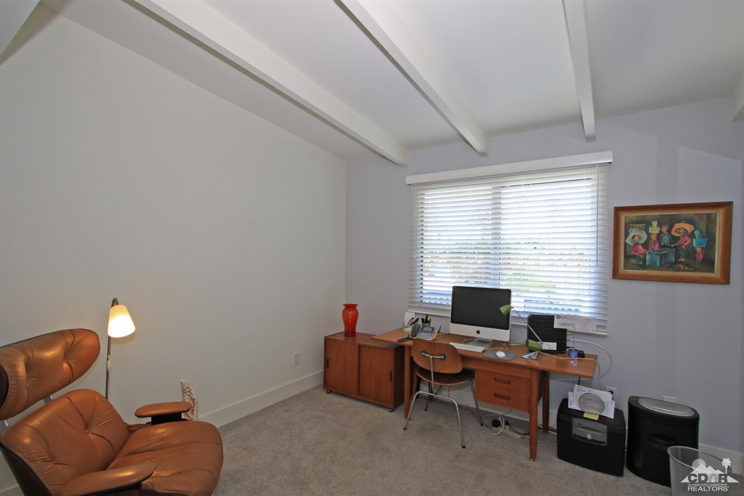 71728 Tunis Road Rancho Mirage, CA 92270 - Photo 29 of 44 a living room with furniture a window and a flat screen tv