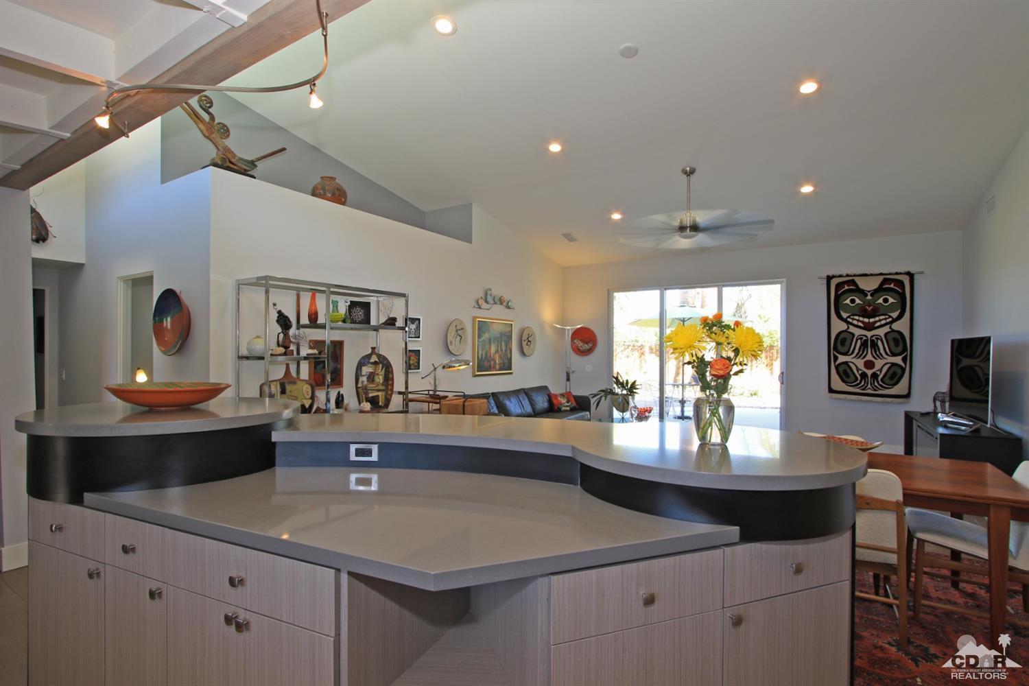 71728 Tunis Road Rancho Mirage, CA 92270 - Photo 4 of 44 a room with stainless steel appliances kitchen island granite countertop a table and chairs in it