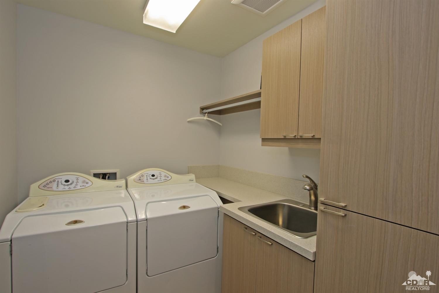 71728 Tunis Road Rancho Mirage, CA 92270 - Photo 31 of 44 a utility room with dryer and washer