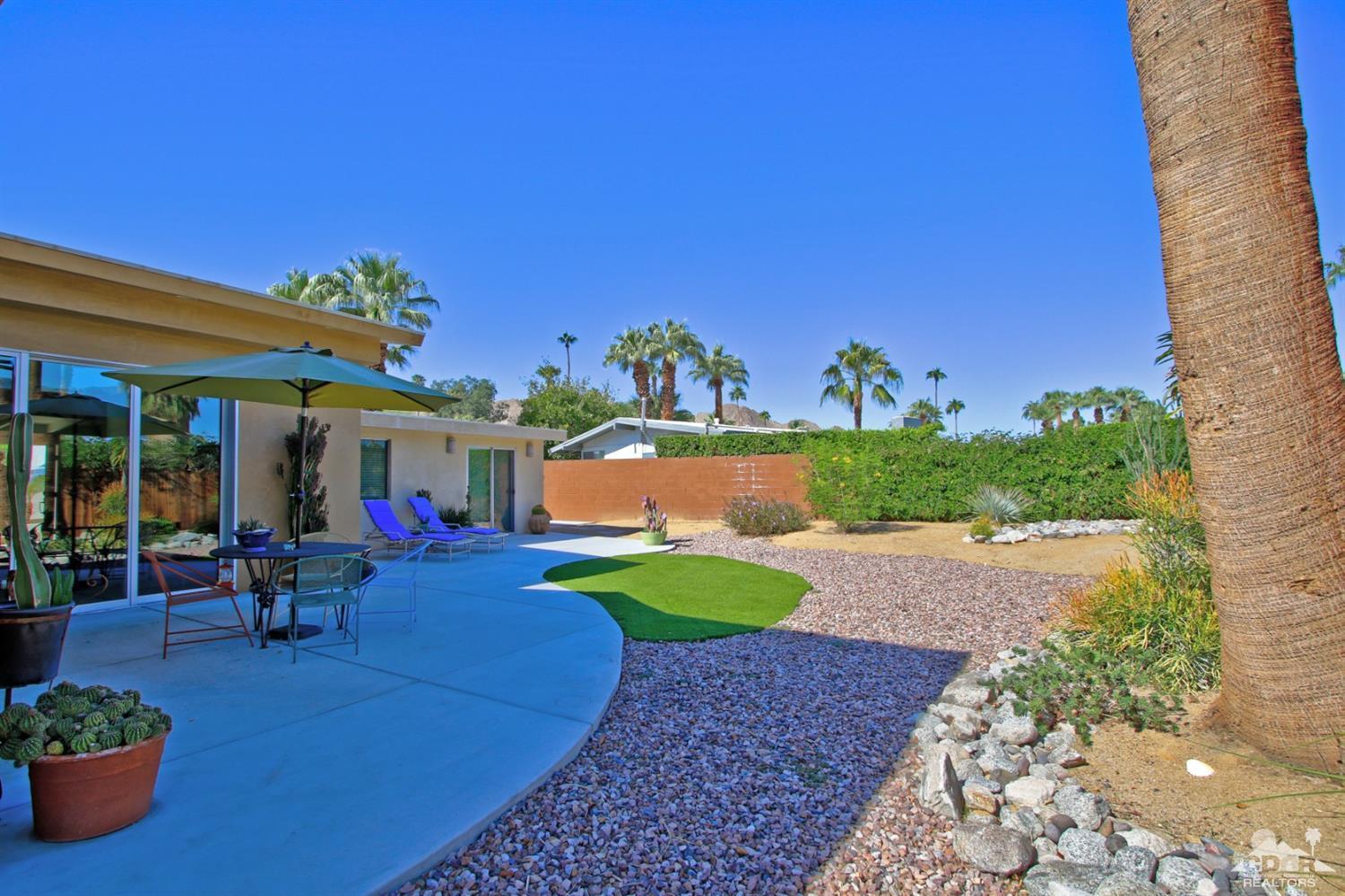 71728 Tunis Road Rancho Mirage, CA 92270 - Photo 40 of 44 a view of a backyard with plants and patio