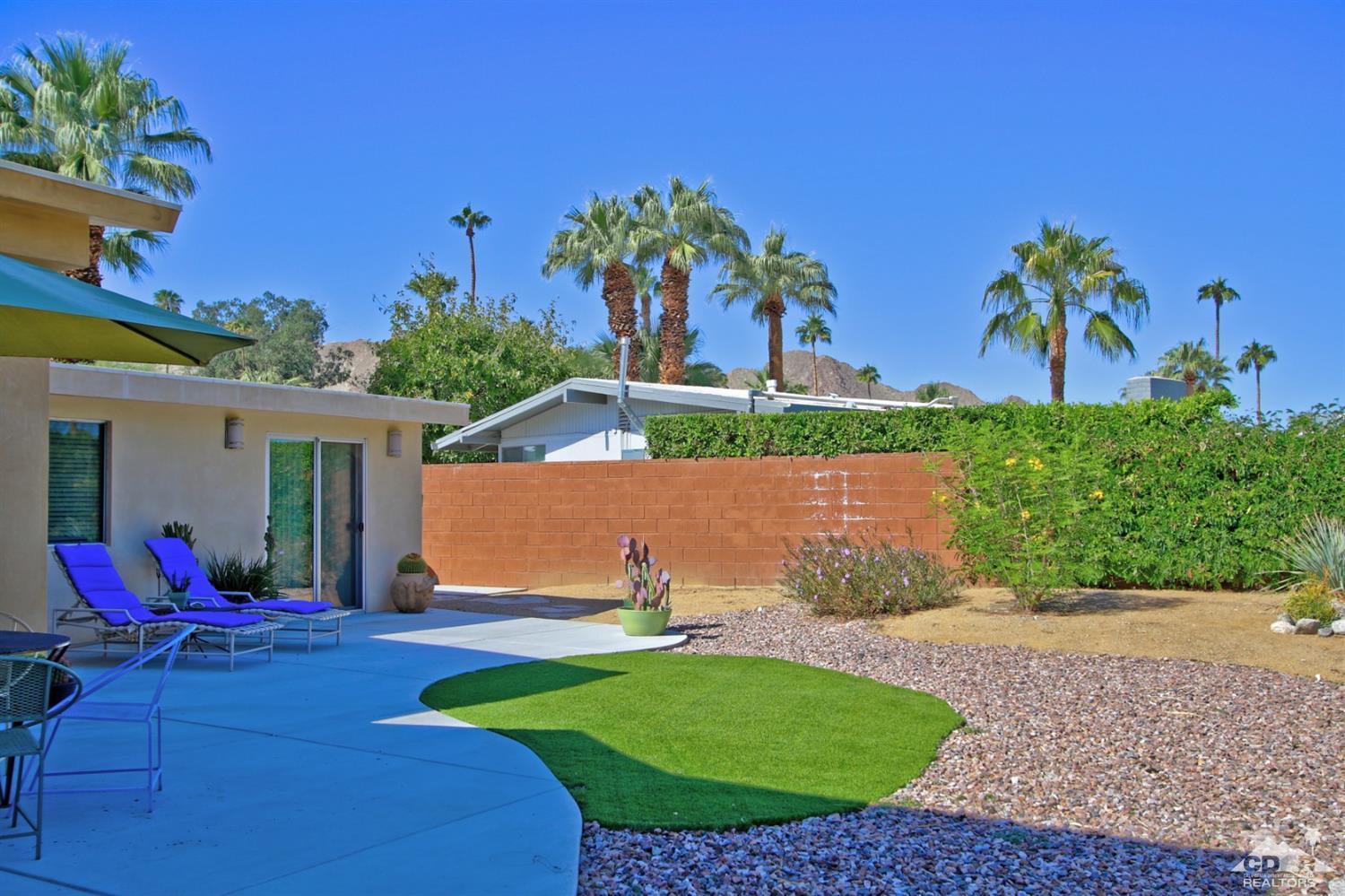 71728 Tunis Road Rancho Mirage, CA 92270 - Photo 42 of 44 a view of a backyard with a garden and plants