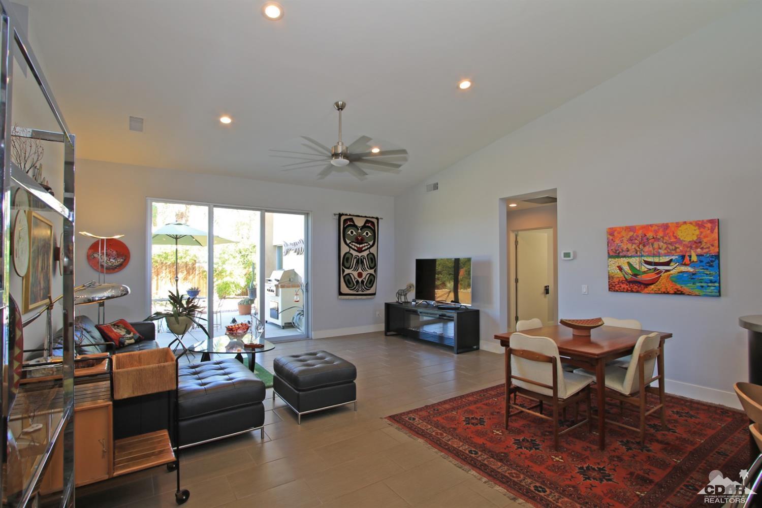 71728 Tunis Road Rancho Mirage, CA 92270 - Photo 7 of 44 a living room with furniture and a flat screen tv