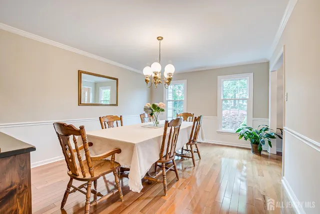 a living room with furniture a fireplace and a large window