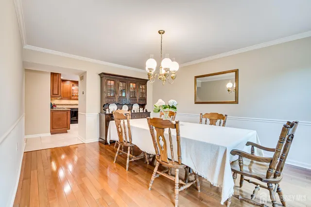 a bedroom with furniture and a large window