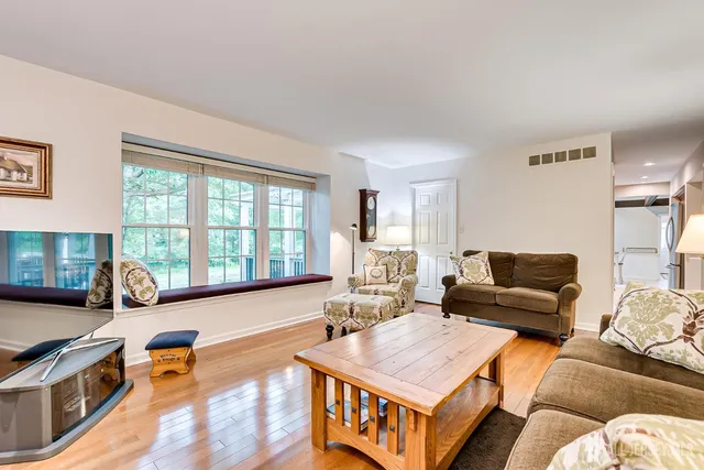 a spacious bedroom with a bed and ceiling fan