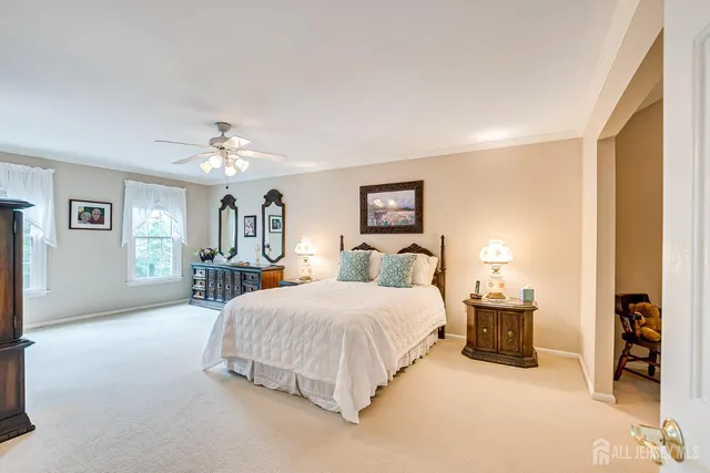a bathroom with a granite countertop sink a mirror and shower