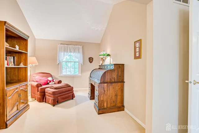 a bedroom with two beds and a window