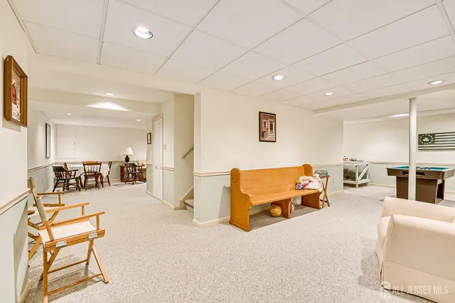 swimming pool view with a garden and plants