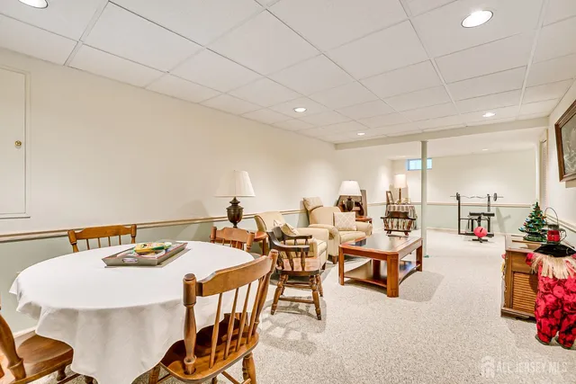 an aerial view of residential houses with outdoor space and trees