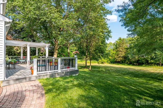 an aerial view of a house with garden space and street view