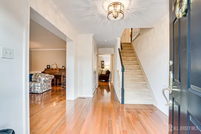 a view of a livingroom with furniture and hardwood floor