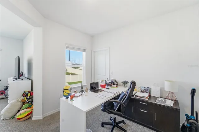 a view of a workspace with furniture