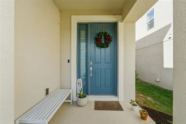 a view of a door and chair in a room