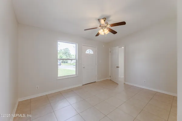 a view of an empty room with a window