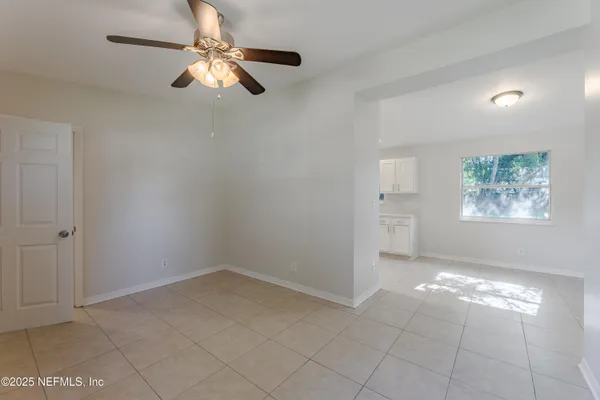 a view of an empty room with a window