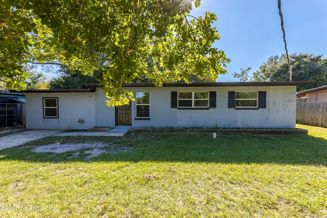 a backyard of a house with lots of green space