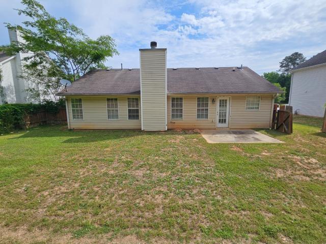 1443 Pebble Ridge Lane Hampton, GA 30228 - Photo 23 of 24 a house view with a garden space