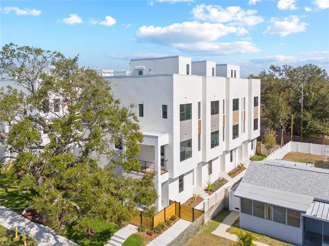 a view of a building with a yard