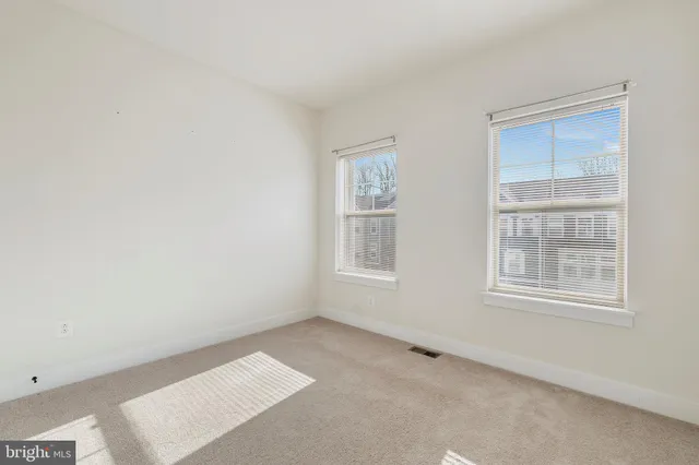 a bathroom with a sink a toilet and shower curtain