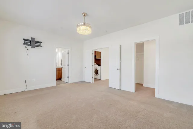 a bathroom with a double vanity sink mirror and shower