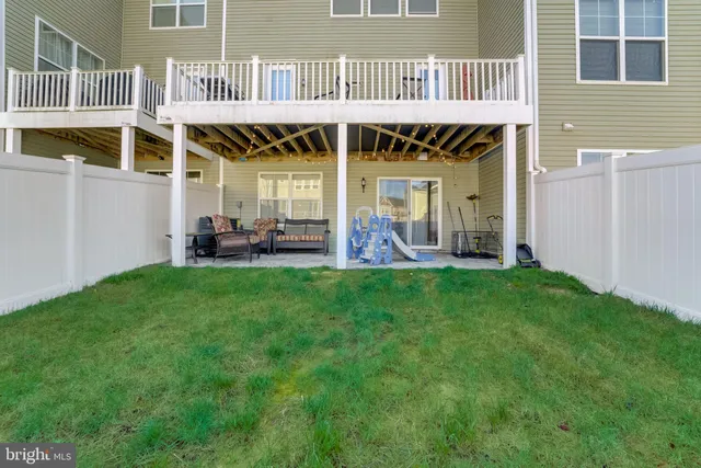 a front view of a house with seating space