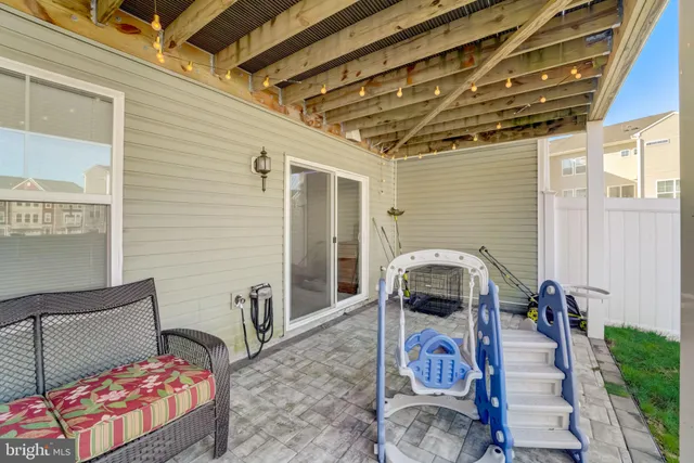 a view of a house with a yard and sitting area