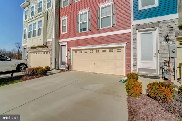 a picture of a wall with a large white refrigerator