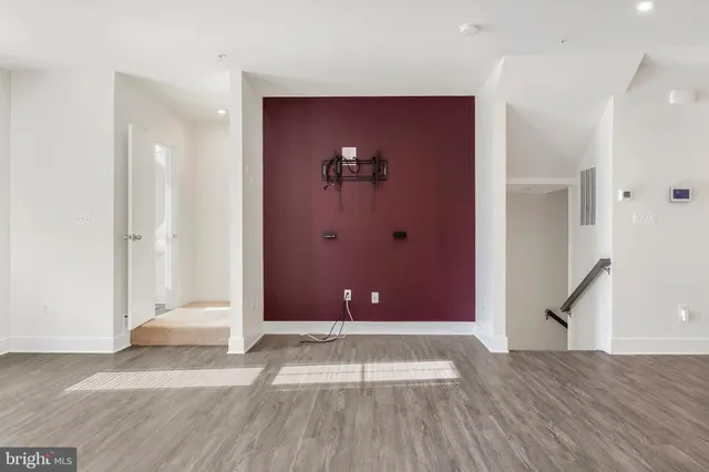 a view of a livingroom with wooden floor