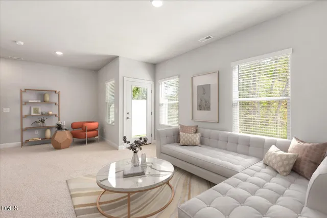 a view of a house with a yard and sitting area