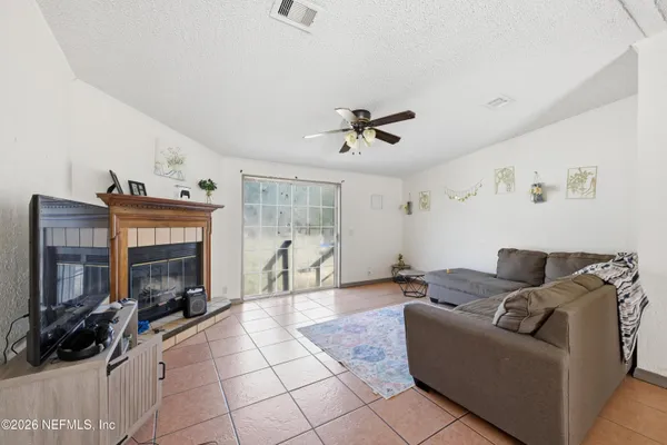 a living room with furniture and a fireplace