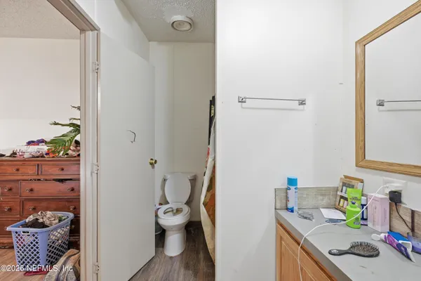 a bathroom with a sink mirror and vanity