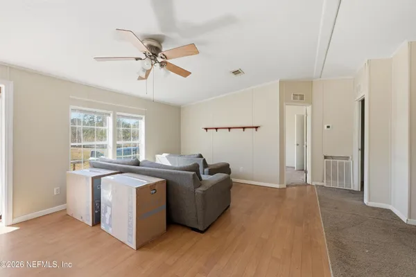 a living room with furniture and a window