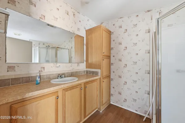 a bathroom with a sink and a mirror