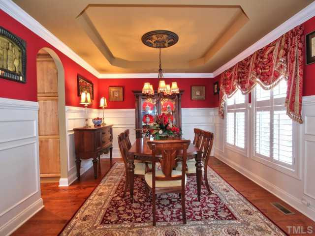 10149 Darling Street Raleigh, NC 27613 - Photo 3 of 25 The hardwoods and the molding flow over from the living room into the dining room. Here you will also find a beautiful trey ceiling and a separate entrance to the kitchen. Dining Room