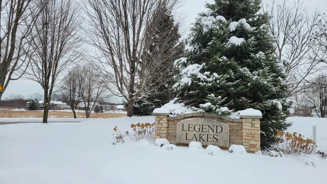 a view of street with snow on the road