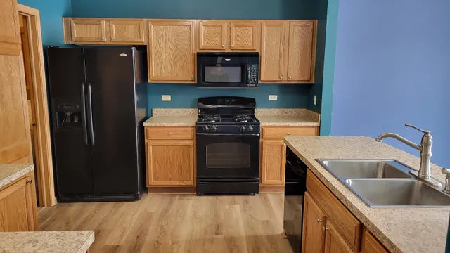 a kitchen with a stove microwave and refrigerator