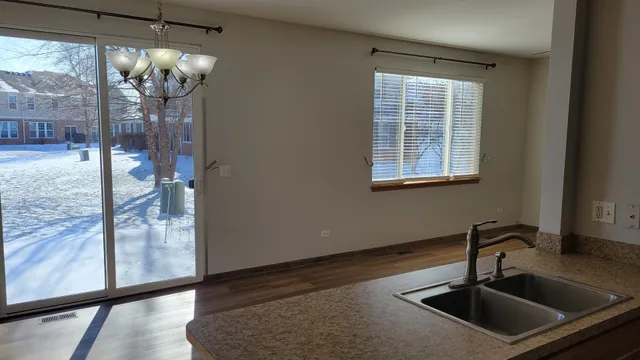 a kitchen with a sink and a mirror