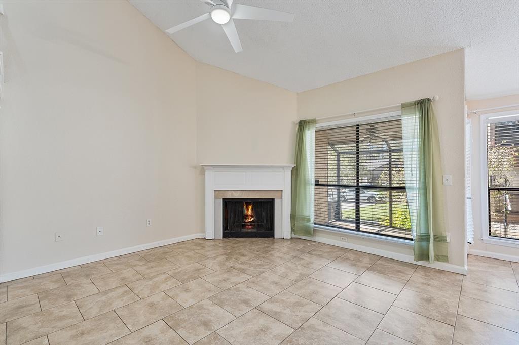 940 Douglas Avenue, Unit 158 Altamonte Springs, FL 32714 - Photo 9 of 23 an empty room with fireplace and windows
