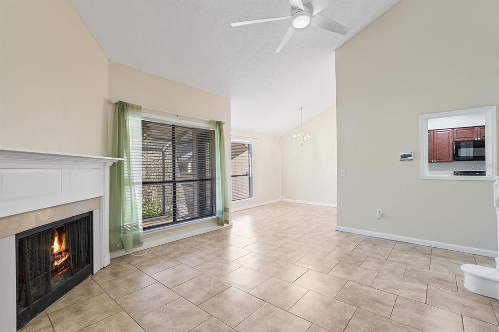 940 Douglas Avenue, Unit 158 Altamonte Springs, FL 32714 - Photo 10 of 23 a view of an empty room with a fireplace and a window