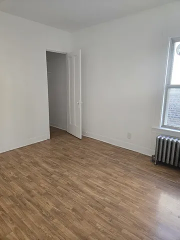 a bathroom with a toilet a sink and a mirror
