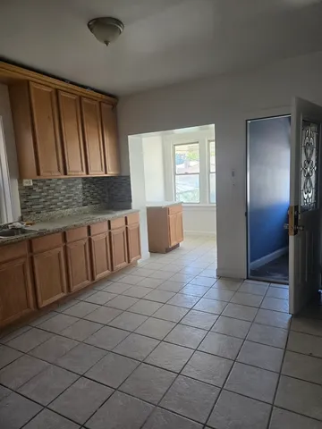 a view of an empty room and a window