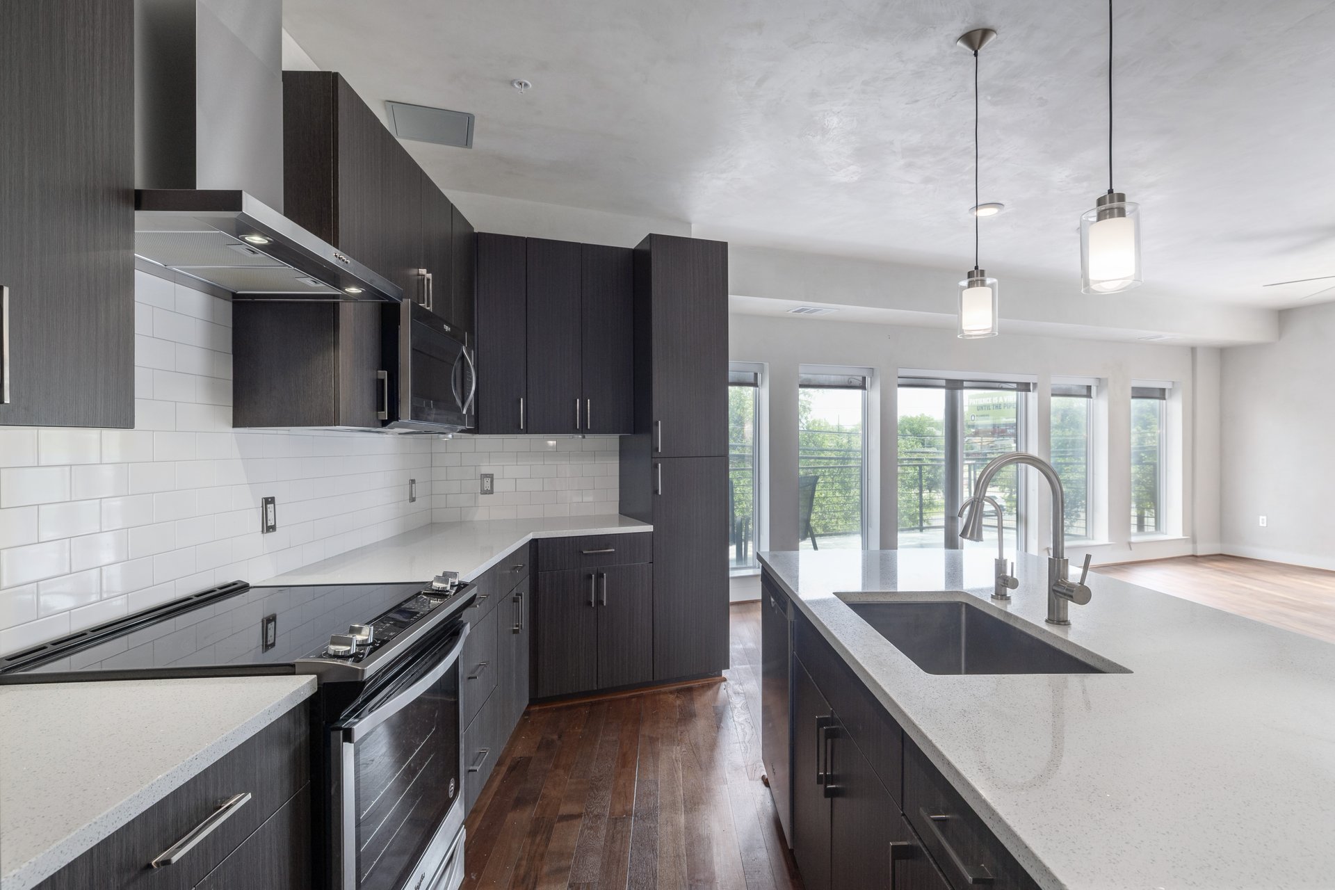 6444 Burnet Road, Unit 100 Austin, TX 78757 - Photo 15 of 31 Modern kitchen with custom cabinetry.