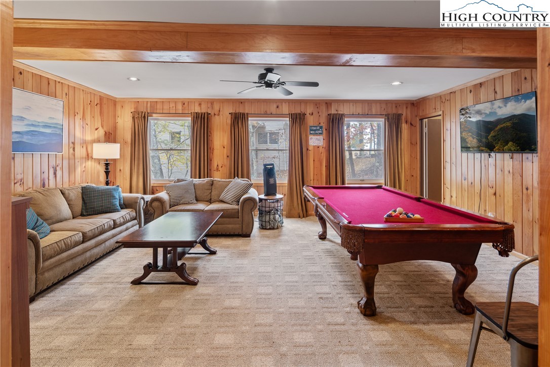 501 St Andrews Road Beech Mountain, NC 28604 - Photo 24 of 46 a living room with furniture pool table and a large window