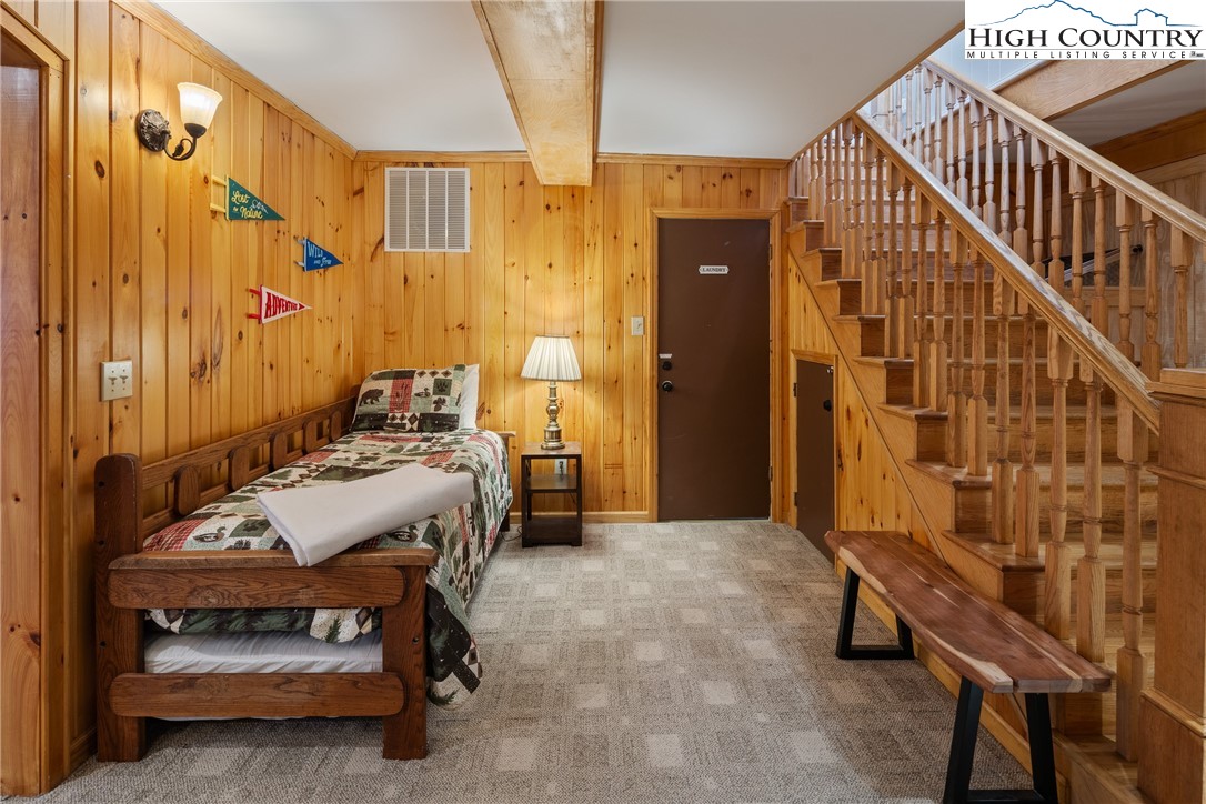501 St Andrews Road Beech Mountain, NC 28604 - Photo 27 of 46 a bedroom with a bed and a window