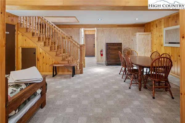 a view of a house with a yard and sitting area